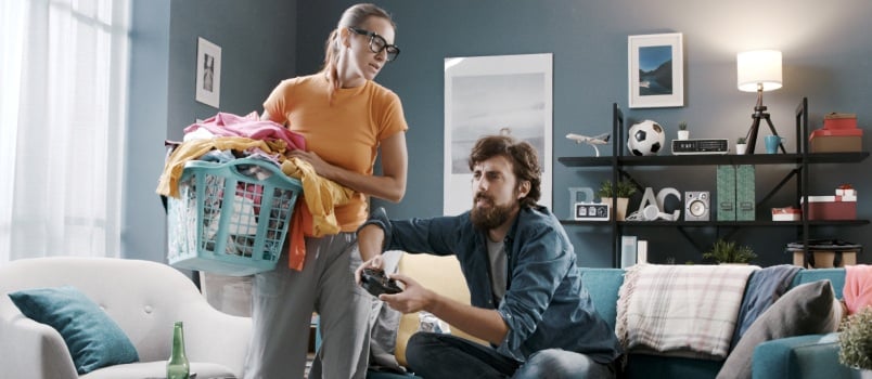 Lazy Husband Playing Video Game While Relaxing on Coach