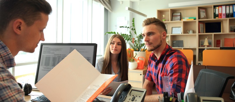 Successful lawyer giving consultation to couple