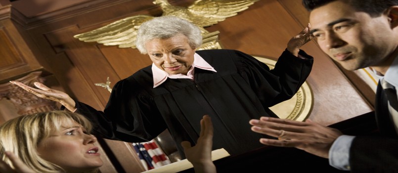 couple arguing in front of judge in court