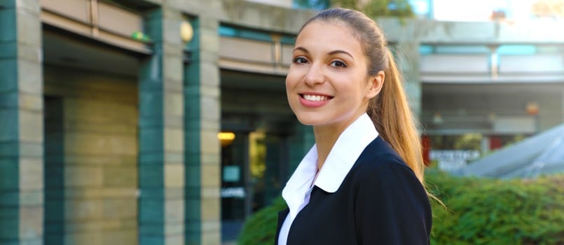 Smiling you business women posing