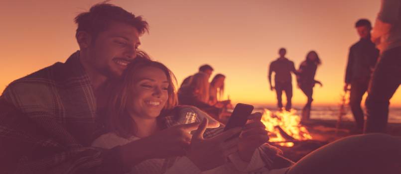 Couple sitting near fire place