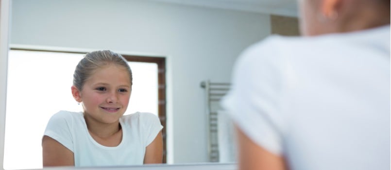 Girl looking in mirror