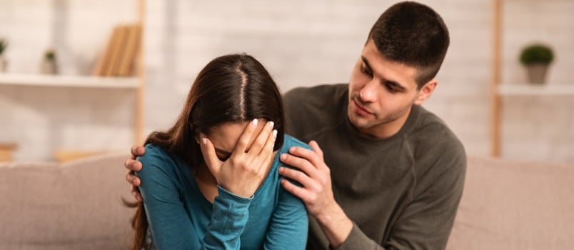 Man Comforting Her Women With Compassion