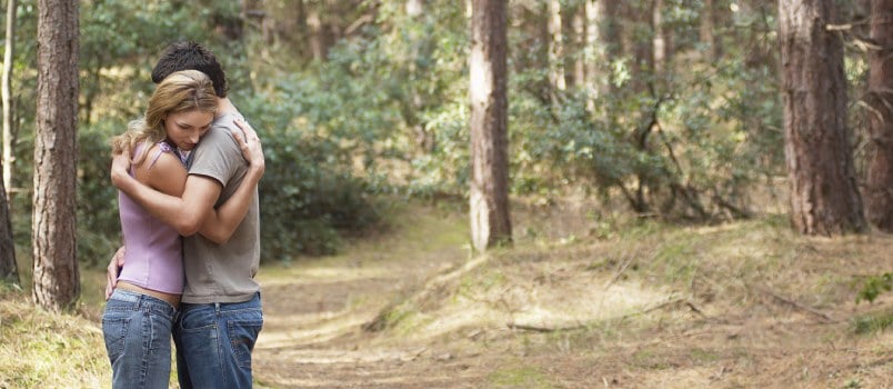 Couple Hugging Each Other in Forest
