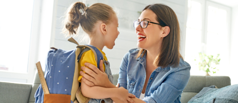 Mother sending daughter to school