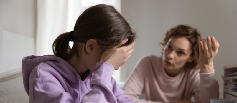 Mom yelling at sad kid