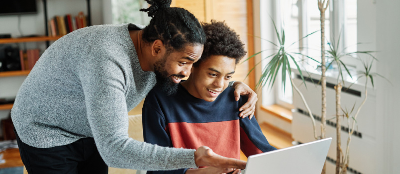 Father and kid doing online shopping