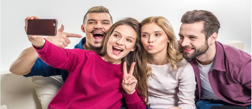 Happy friends taking selfie