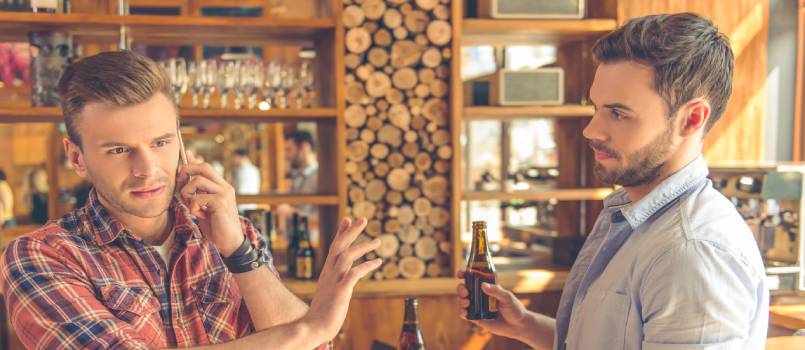 Two young man drinking beer