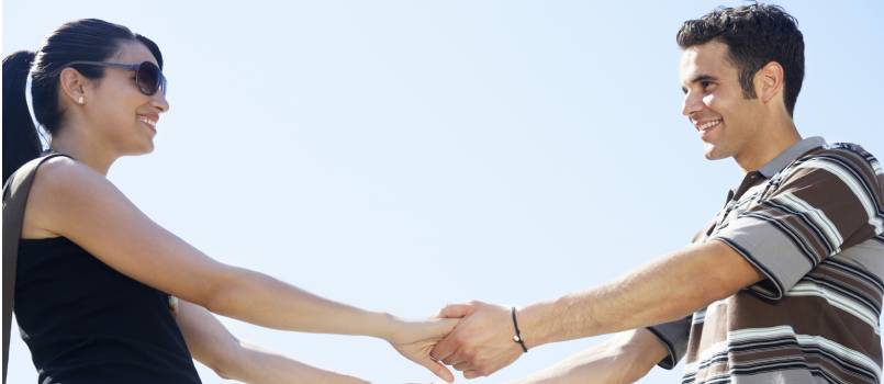 Couple holding each other hand