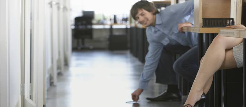 Man picking pen up from floor