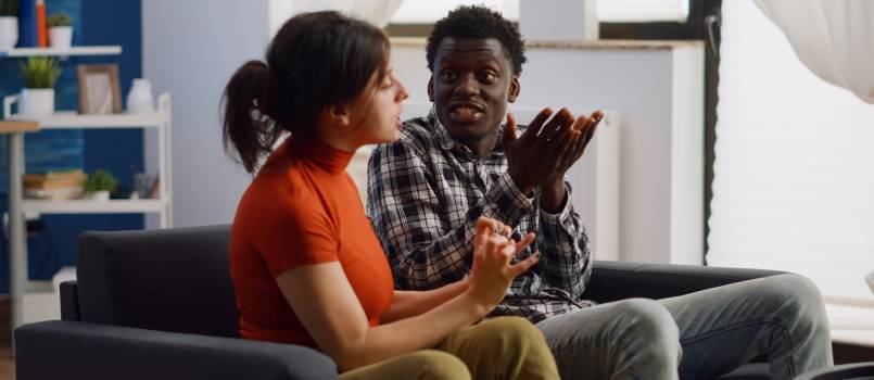 Couple fighting in living room