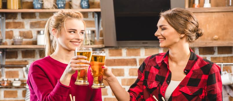 Happy women drinking beer