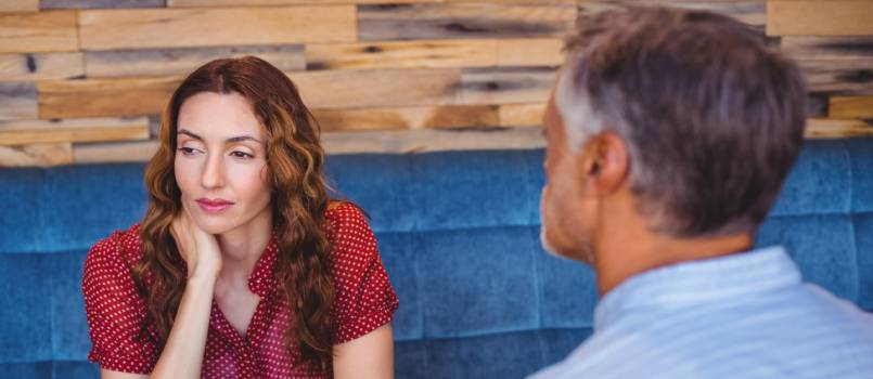 Bored couple having coffee