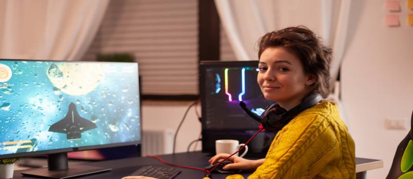 Women playing games on computer