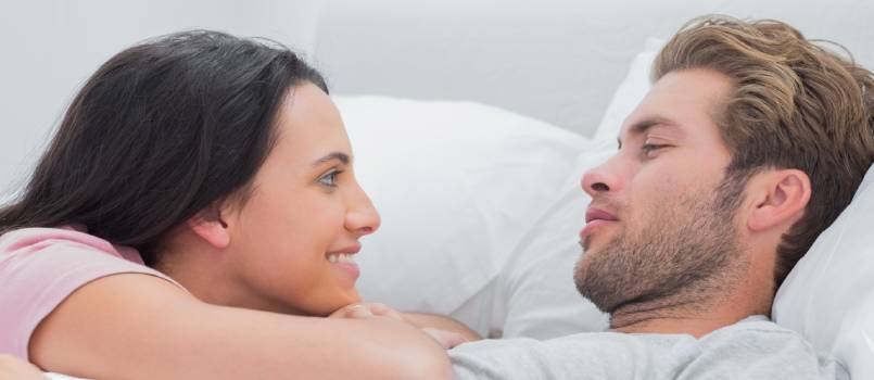Couple awaking and looking at each other