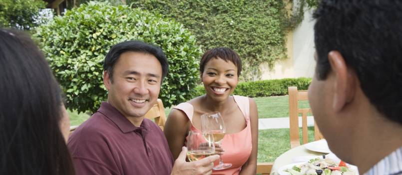 Couple holding glass of wine