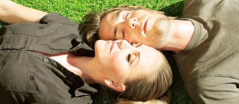 Happy couple laying outdoor