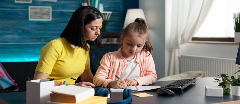 Child and parent doing homework together