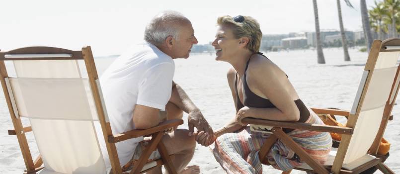 Couple sitting on beach side