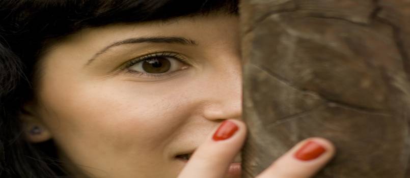 Girl behind the tree