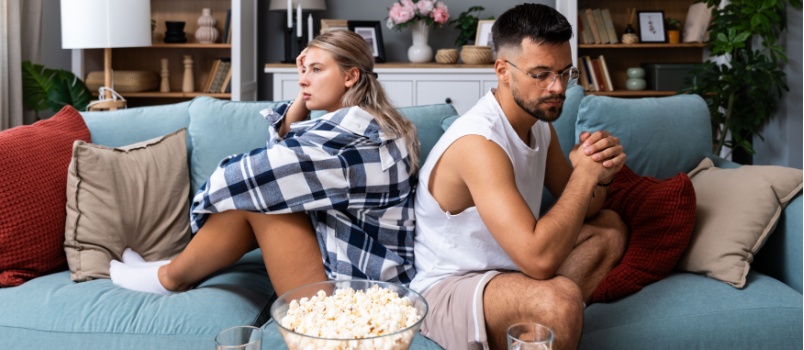 Young couple sitting separately