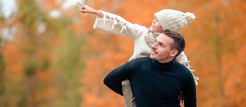Dad and kid enjoying in park