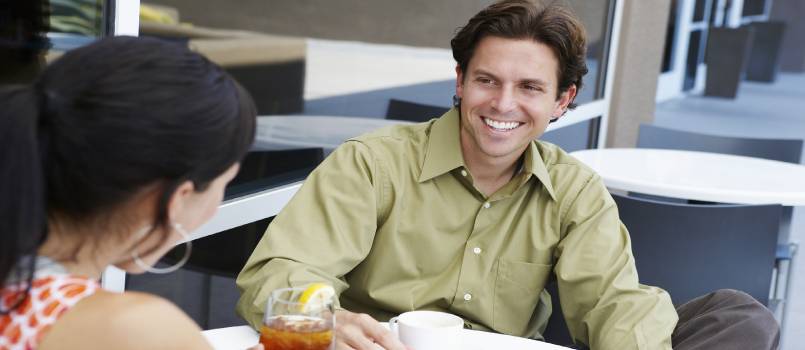 Cheerful enjoying in restaurant with women