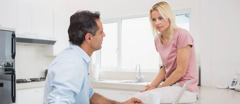 Serious couple talking with each other