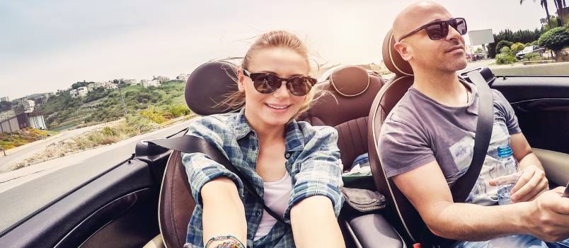Happy couple in the car