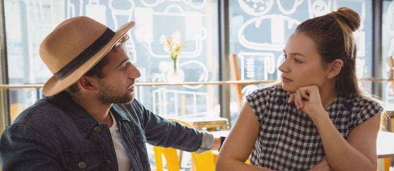 Couple talking at cafe