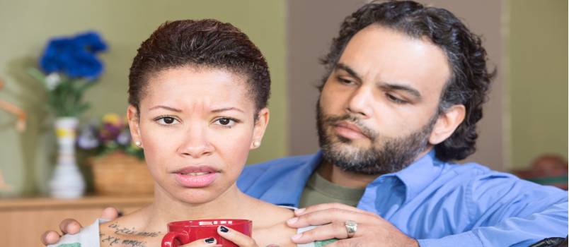 Concerned husband and sand wife