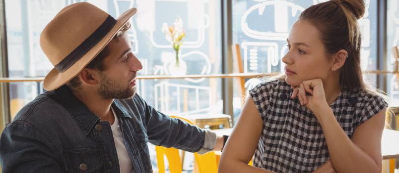 Couple talking at cafe