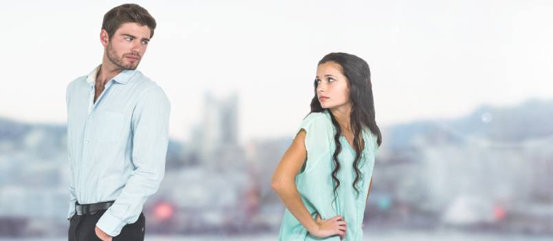 Sad couple parting against cold