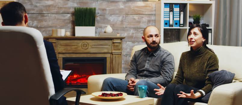 Sad boyfriend sitting on a coach