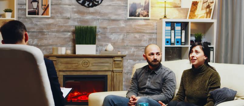 Sad couple with therapist