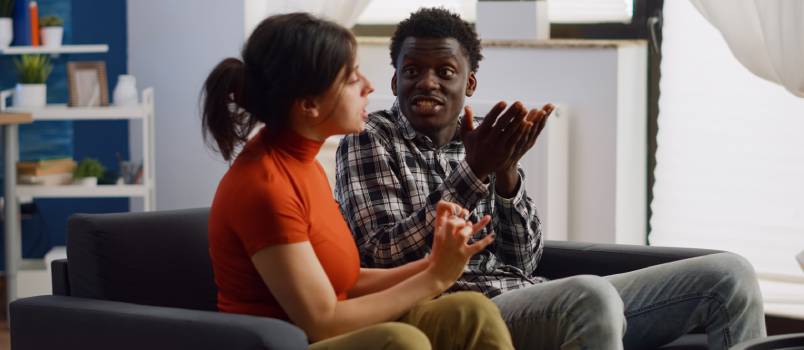 Couple fighting in living room