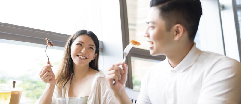 Happy couple having fun during lunch