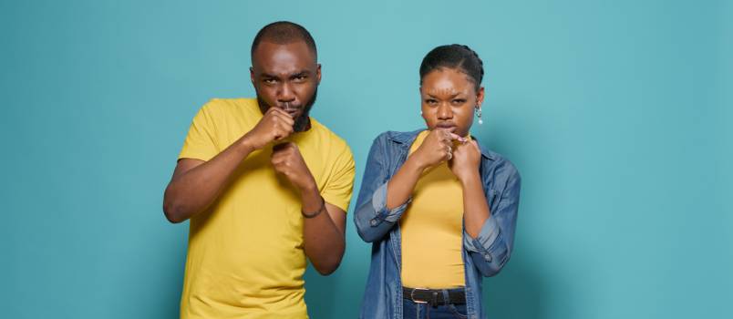 American couple punching in air