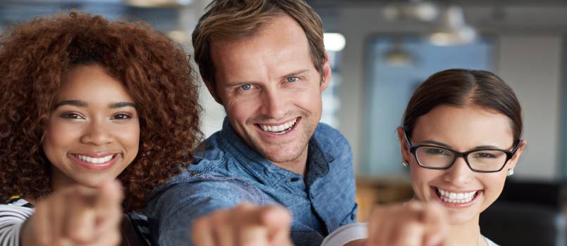 Friends pointing confidently