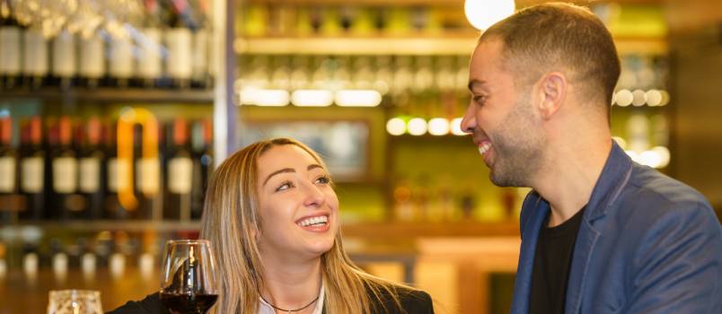Happy couple spending time in pub