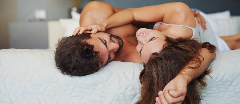 Playful couple in bed