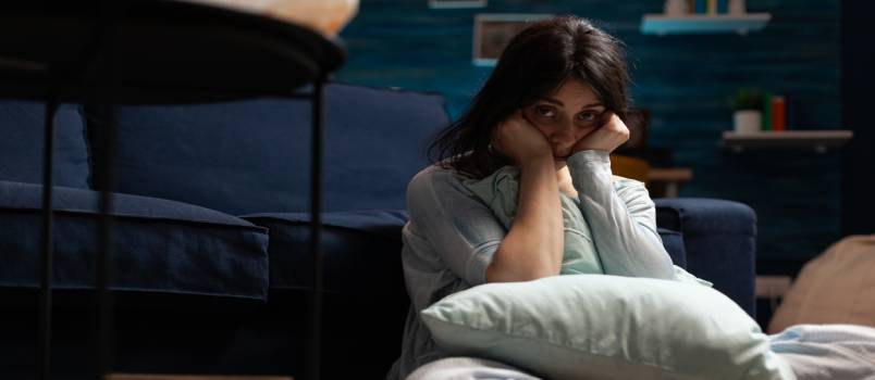 Depressed woman sitting alone 