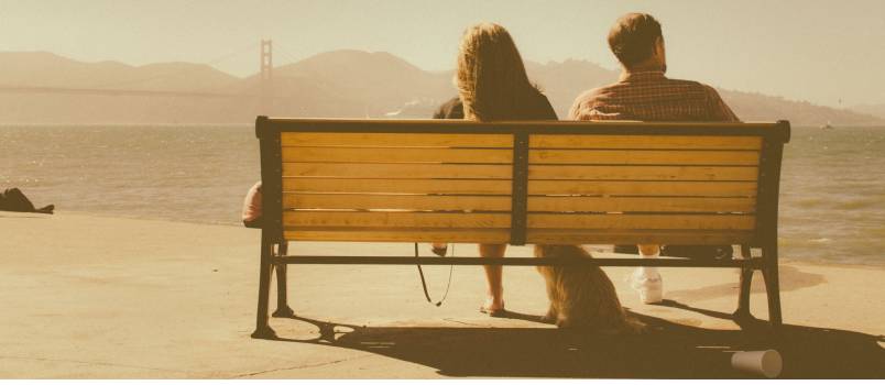 Man and woman sitting outside