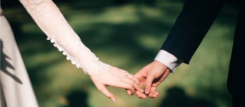 Couple holding each other hands