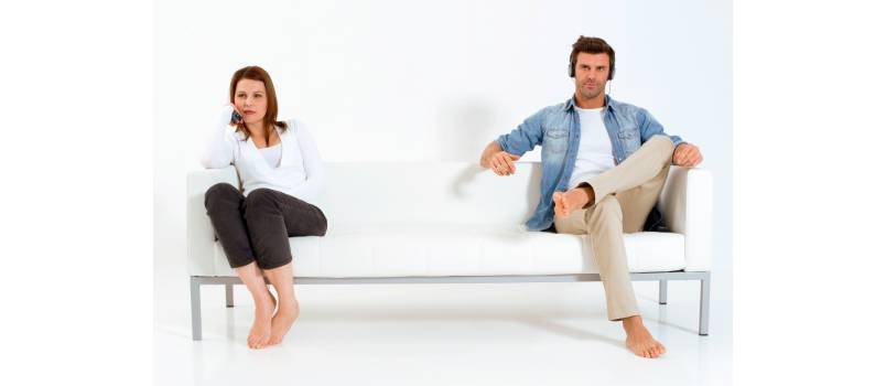 Separated couple on the couch