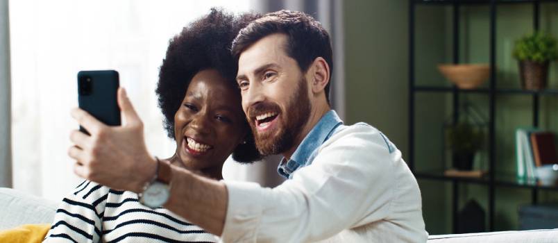 Happy couple taking selfie