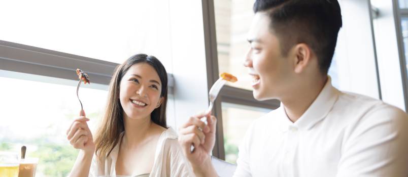 happy couple during lunch in restaurant