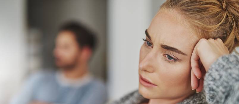 Young unhappy couple at home