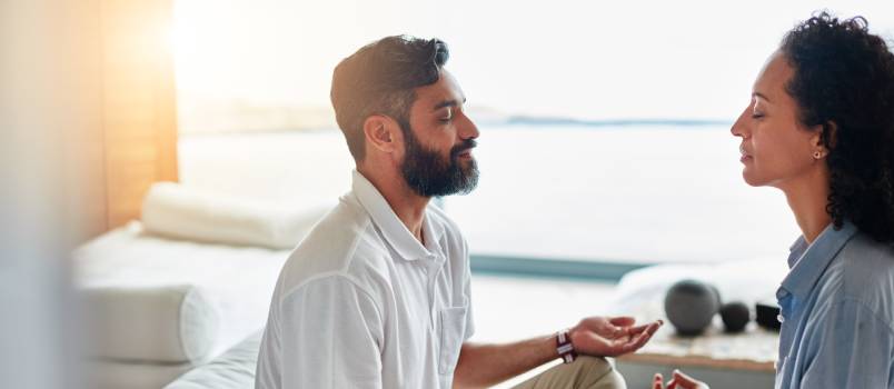 Couple doing meditation together